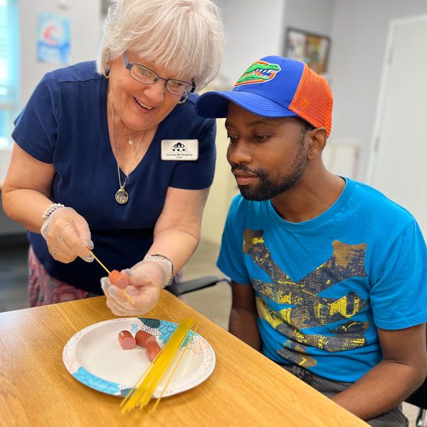 Volunteer assisting a member